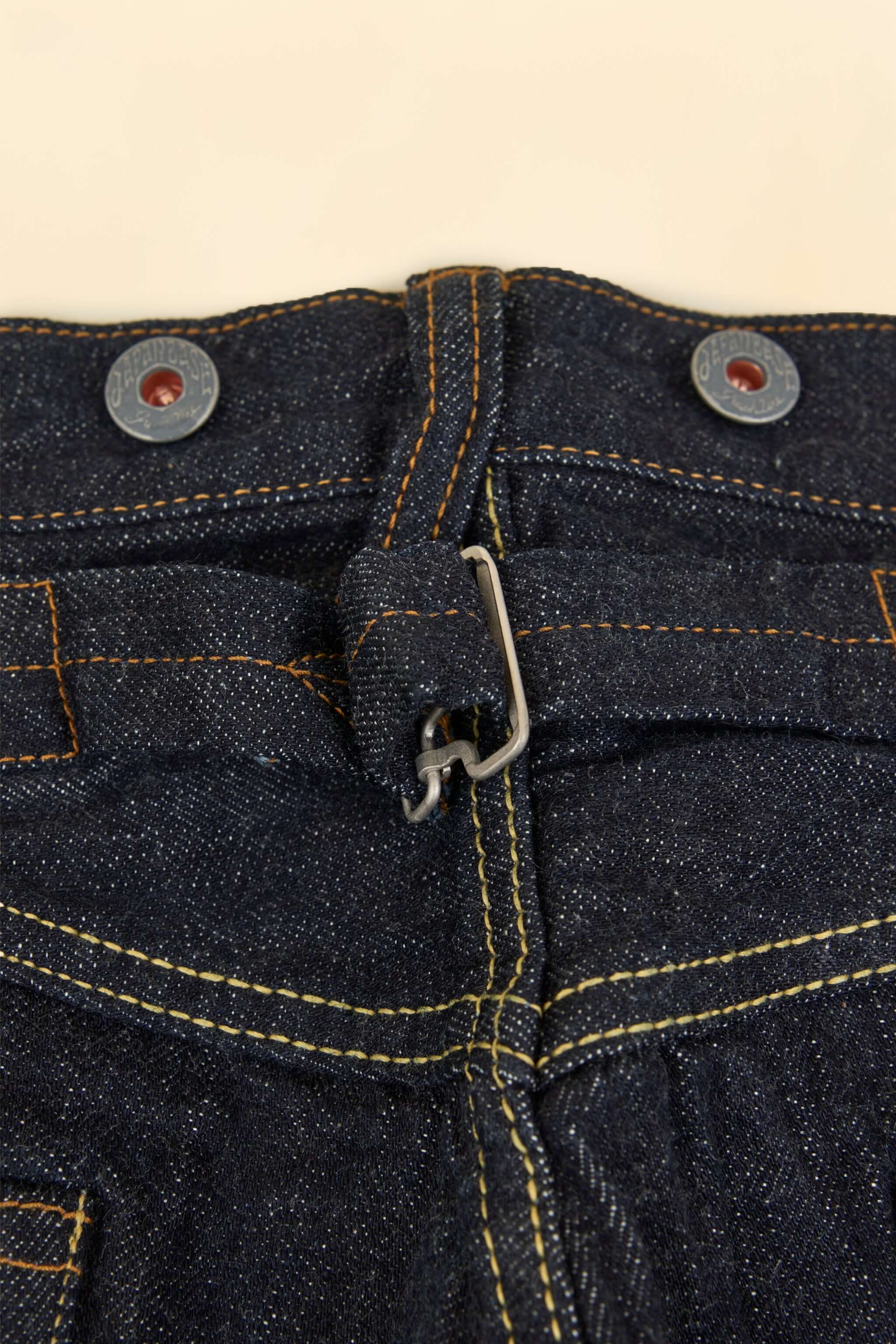 Graph Zero Heritage Denim - 13oz close-up of metal button fly and cinch-back closure.
