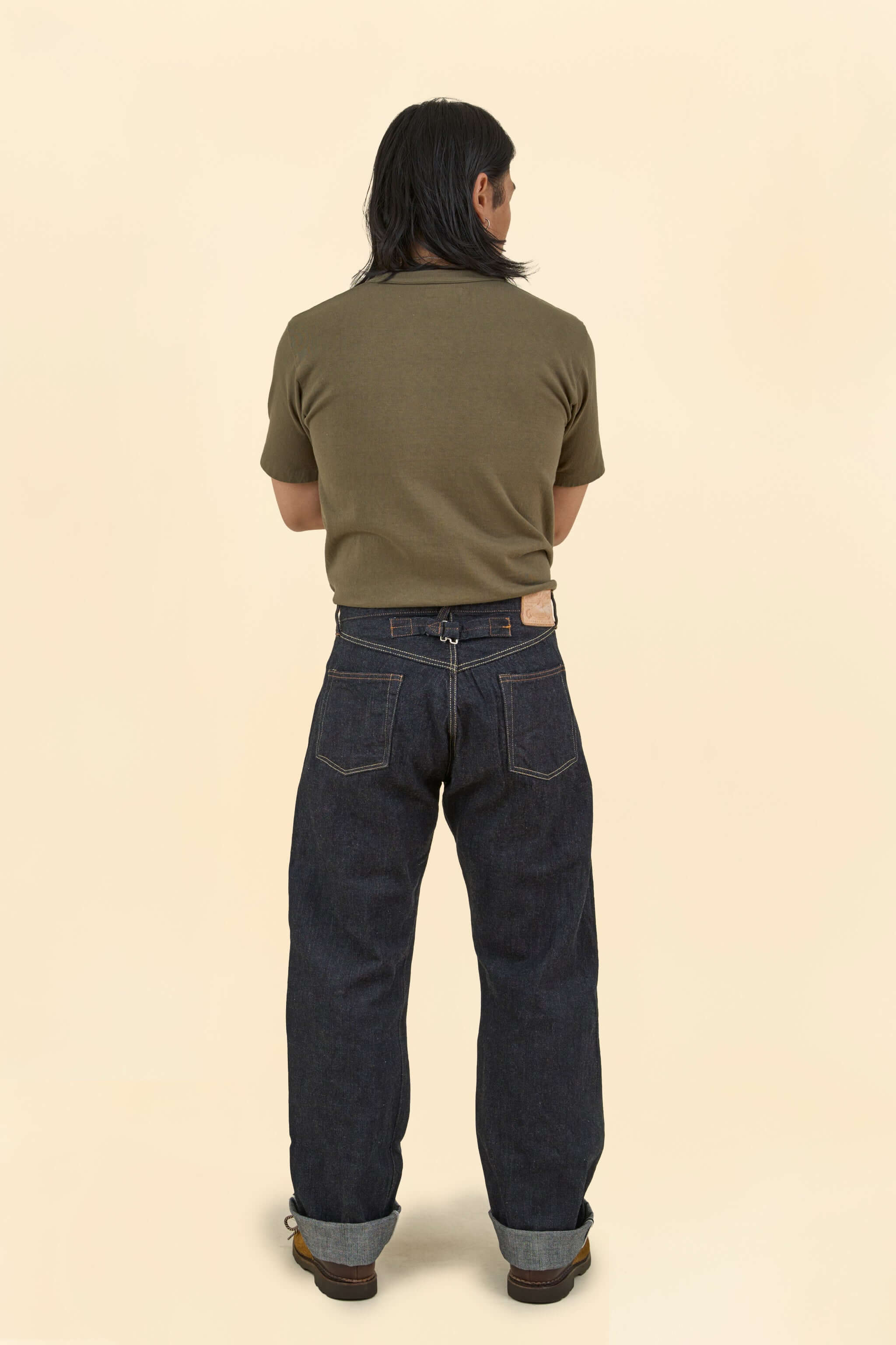 Model wearing Graph Zero Heritage Denim - 13oz, showcasing the back view and wide straight silhouette.