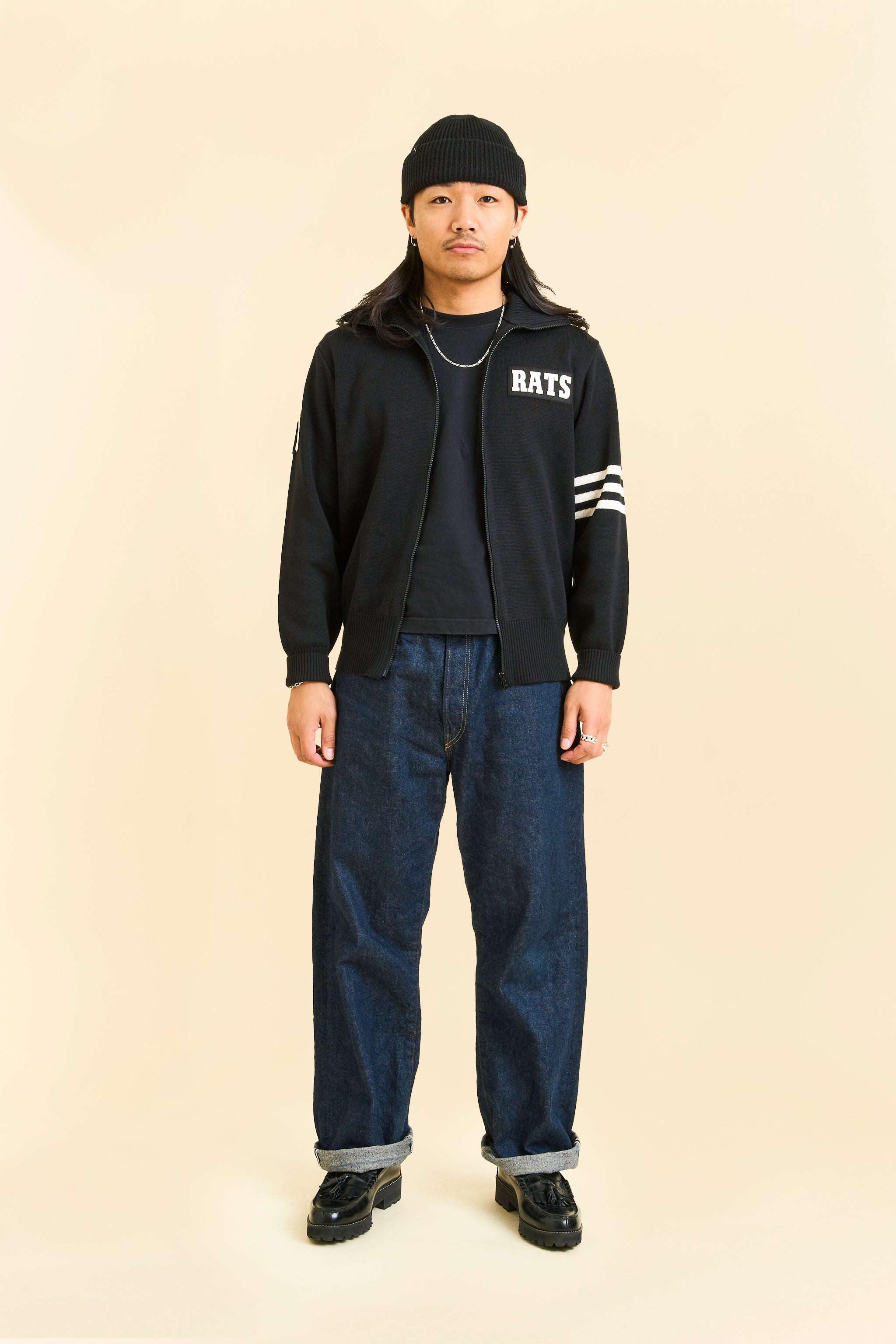 black knit jacket with 'RATS' logo, and zipper detail