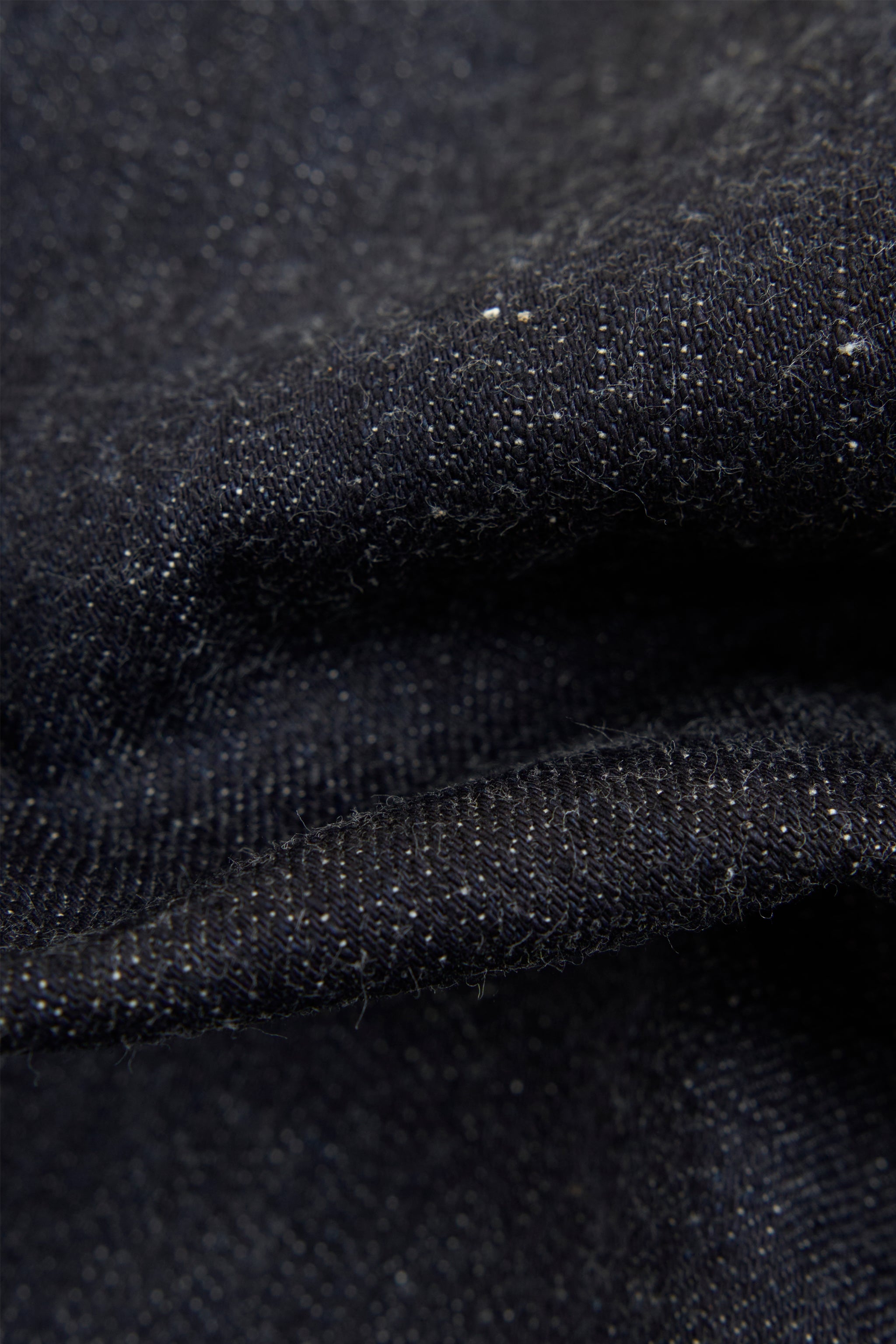 Graph Zero Heritage Denim - 13oz fabric texture showing the clean, even yarn structure and rich color.