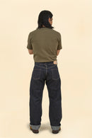 Model wearing Graph Zero Heritage Denim - 13oz, showcasing the back view and wide straight silhouette.