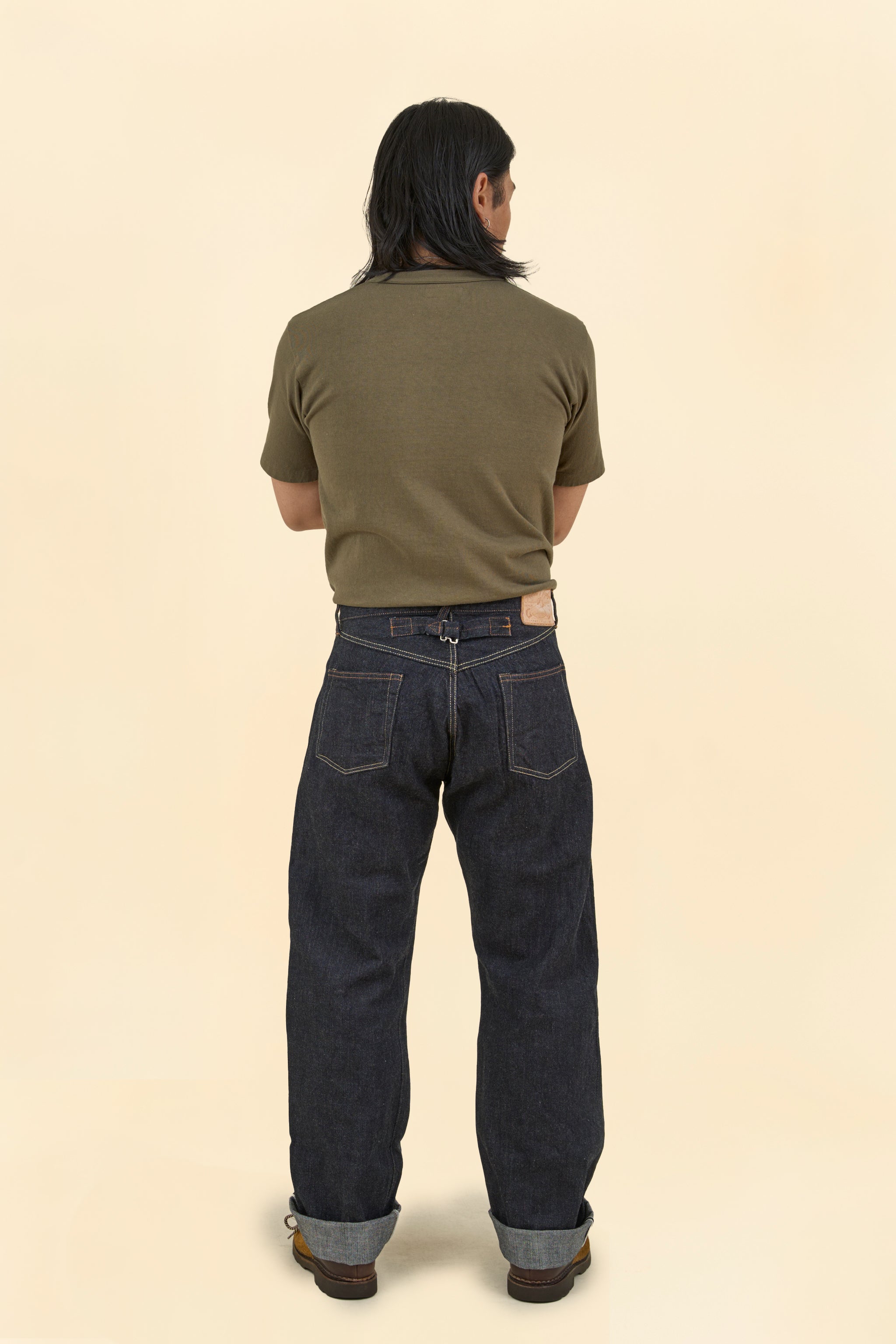Model wearing Graph Zero Heritage Denim - 13oz, showcasing the back view and wide straight silhouette.